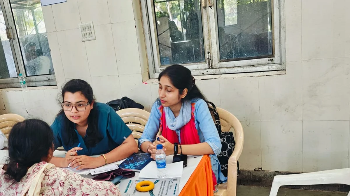 Free physiotherapy consultation desk at a community health camp in Noida